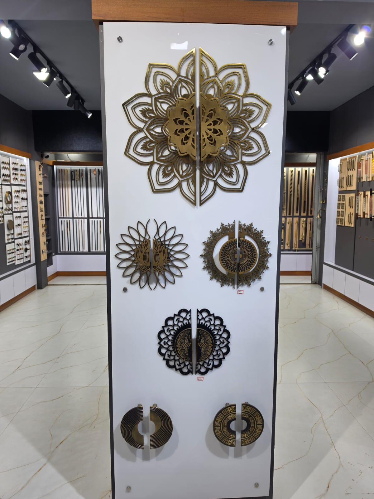 Grand Entrance Brass Mandala Handles on Central Showroom Pillar
